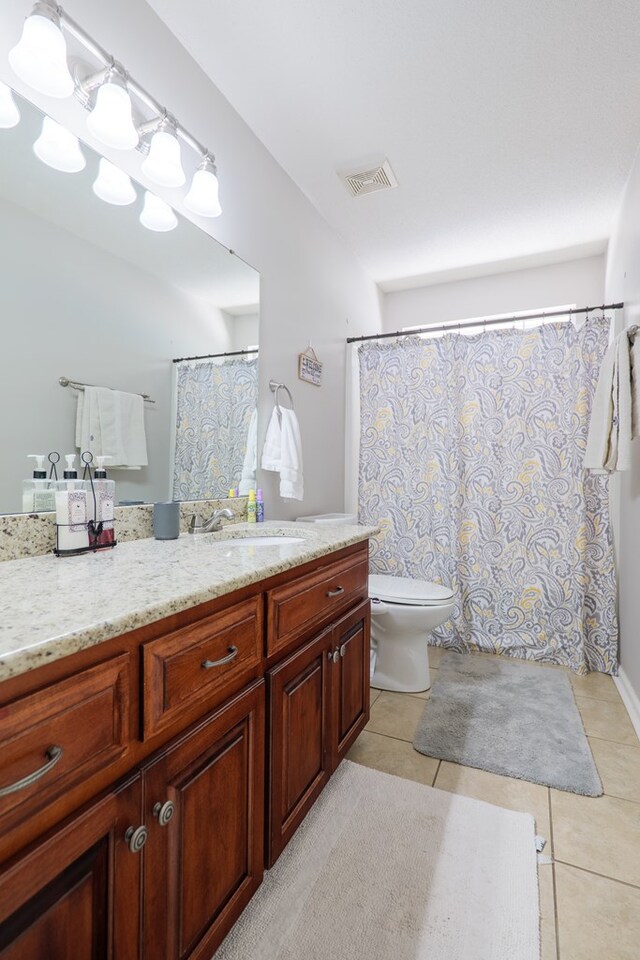 4604 Rustic Ridge Rd, Valdosta, GA 31602 - full bath featuring vanity, tile patterned flooring, and a shower with curtain