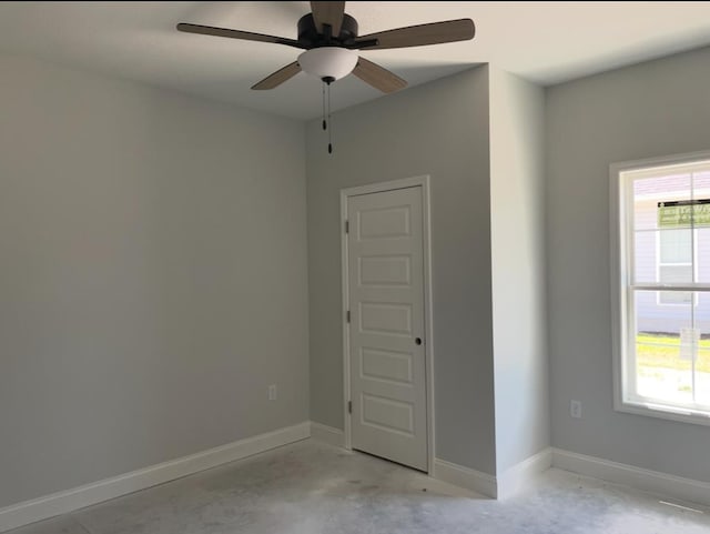 3864 Lu Ln, Hahira, GA 31632 - unfurnished room with unfinished concrete floors, baseboards, and ceiling fan