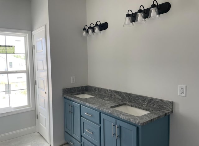 3864 Lu Ln, Hahira, GA 31632 - bathroom featuring baseboards and a sink