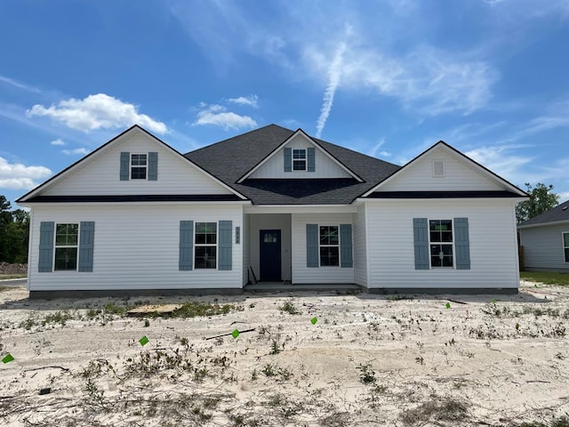 view of front of property with roof with shingles