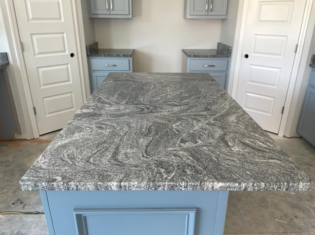 3864 Lu Ln, Hahira, GA 31632 - details with a center island, gray cabinets, and dark stone counters