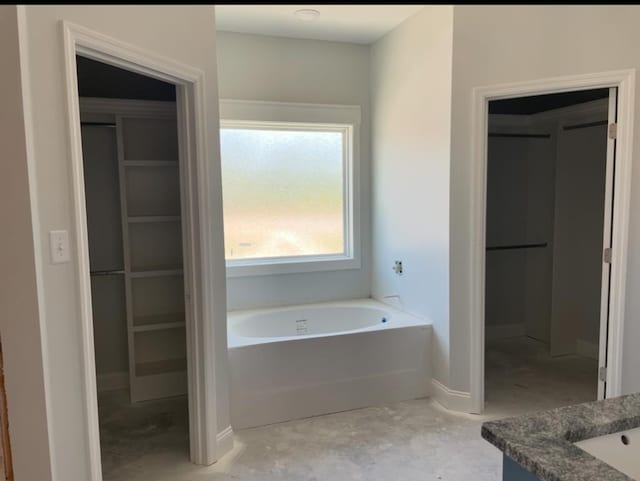 3864 Lu Ln, Hahira, GA 31632 - bathroom with a garden tub and baseboards