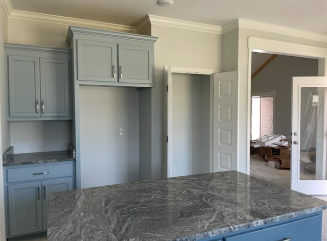 3864 Lu Ln, Hahira, GA 31632 - kitchen featuring ornamental molding and dark stone countertops