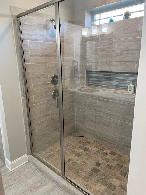4686 Rudy Way, Hahira, GA 31632 - bathroom featuring a shower stall and baseboards