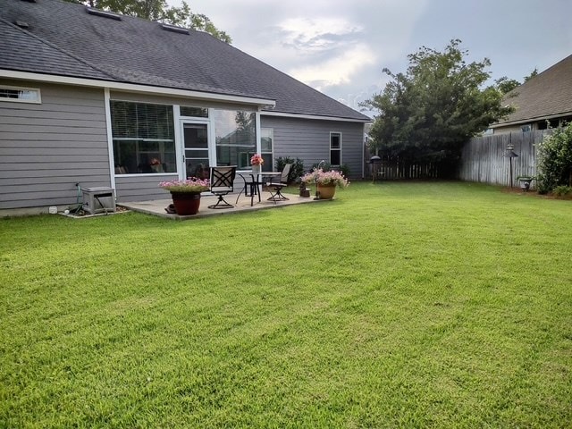 4686 Rudy Way, Hahira, GA 31632 - back of property featuring a patio area and a shingled roof