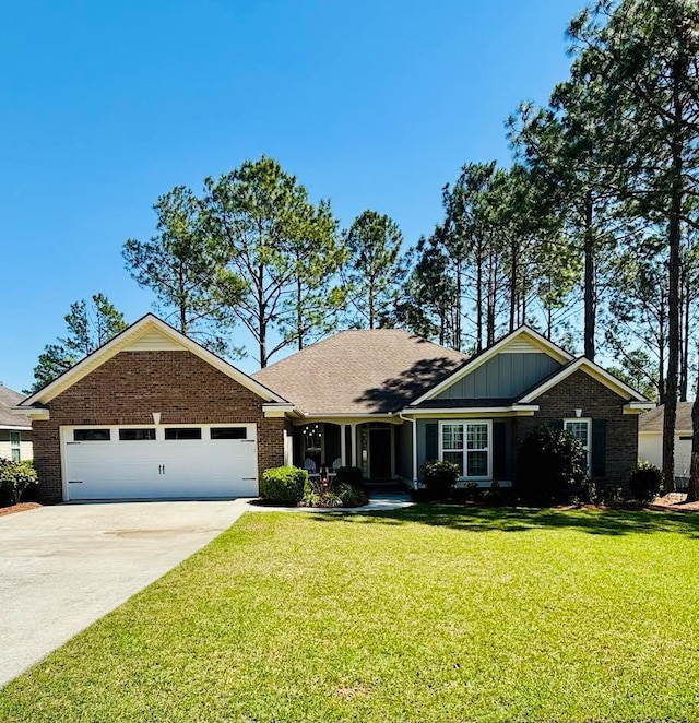 single story home with a front yard, driveway, brick siding, a garage, and board and batten siding