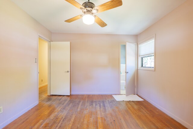 unfurnished room with hardwood / wood-style floors and ceiling fan