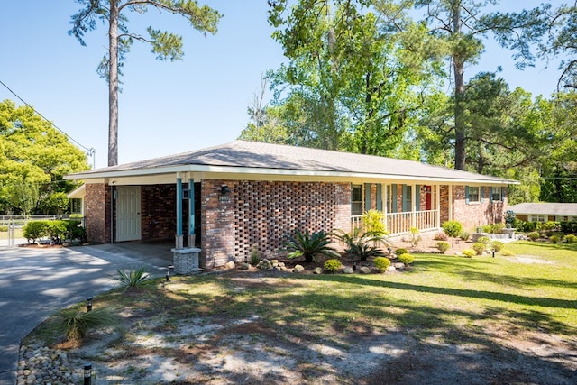 single story home with a carport and a front yard