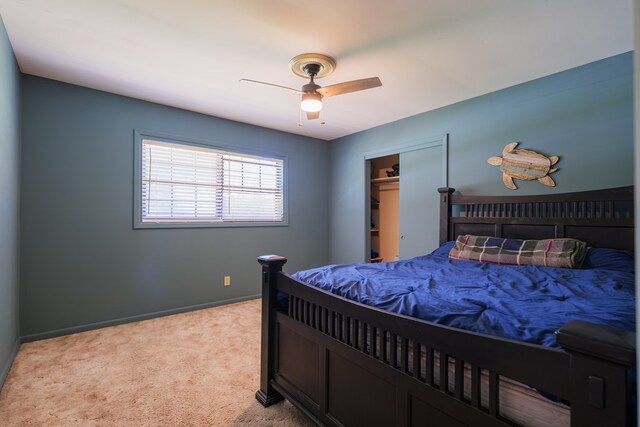 bedroom featuring light carpet, a closet, and ceiling fan