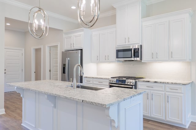 kitchen featuring a kitchen island with sink, white cabinetry, sink, and appliances with stainless steel finishes