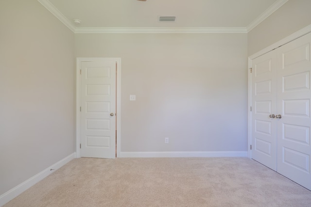 carpeted empty room with ornamental molding