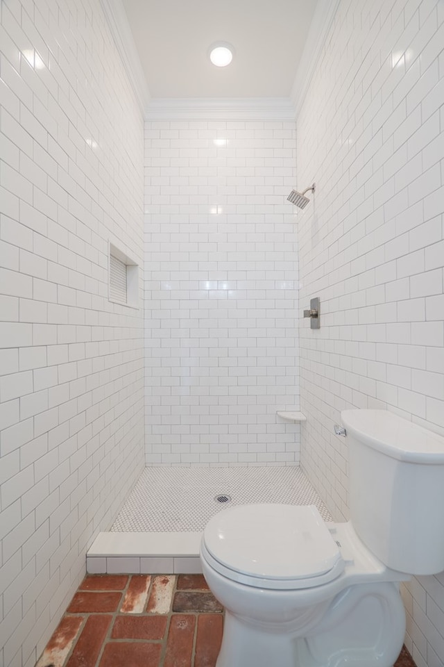 200 E College St, Valdosta, GA 31602 - bathroom with crown molding, toilet, tile walls, and a tile shower