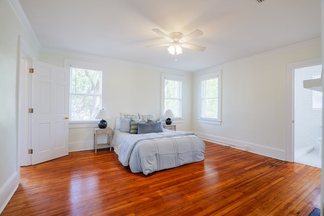 200 E College St, Valdosta, GA 31602 - bedroom featuring crown molding, multiple windows, and wood finished floors