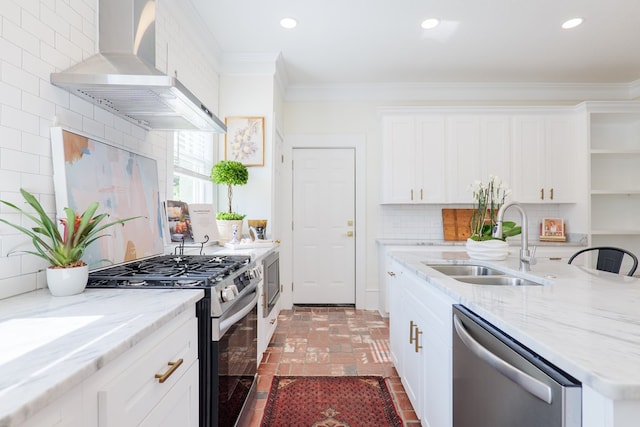 200 E College St, Valdosta, GA 31602 - kitchen with crown molding, a sink, brick floor, stainless steel appliances, and wall chimney exhaust hood