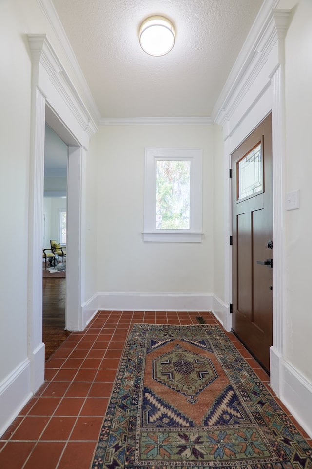 200 E College St, Valdosta, GA 31602 - entryway with dark tile patterned floors, a textured ceiling, and crown molding