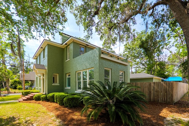 200 E College St, Valdosta, GA 31602 - back of property with stucco siding and fence