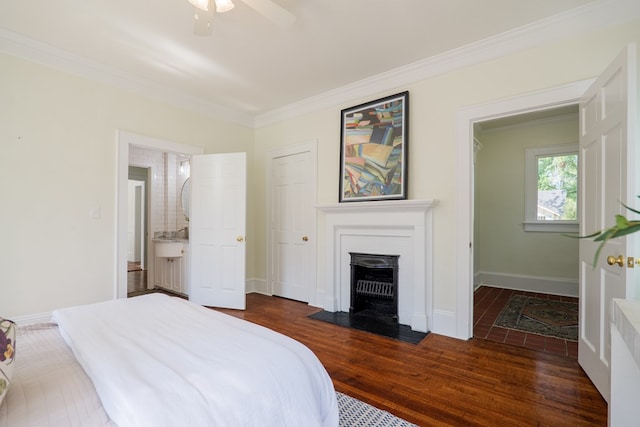 200 E College St, Valdosta, GA 31602 - bedroom with a ceiling fan, baseboards, a fireplace with flush hearth, dark wood-type flooring, and ornamental molding