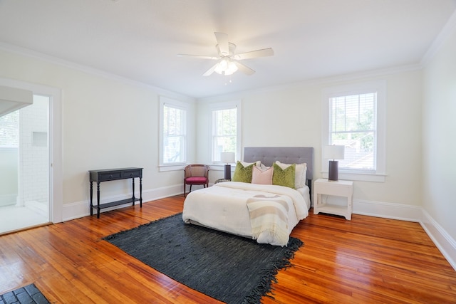 200 E College St, Valdosta, GA 31602 - bedroom featuring baseboards, a ceiling fan, crown molding, and hardwood / wood-style floors
