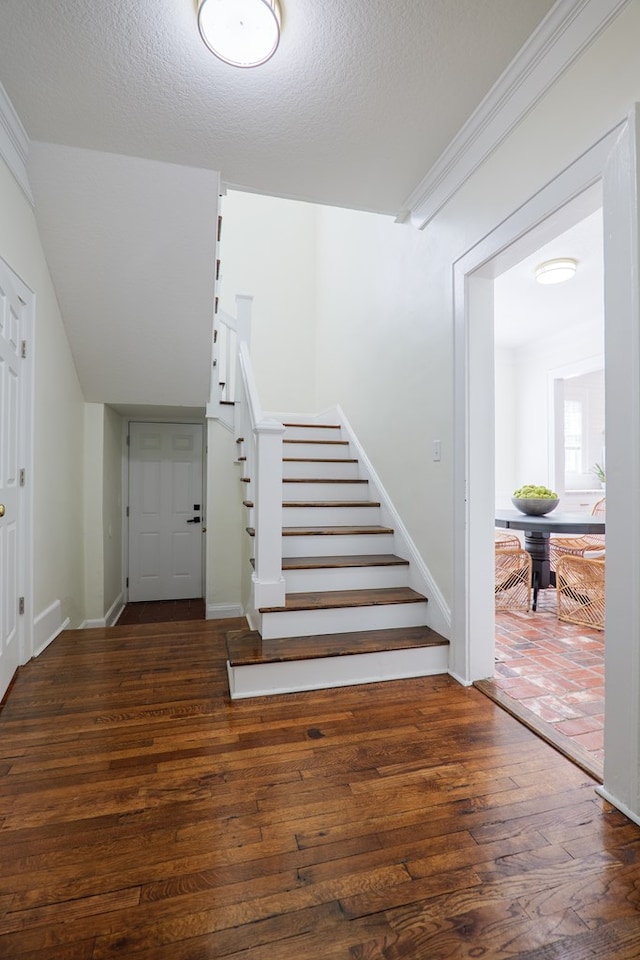 200 E College St, Valdosta, GA 31602 - staircase with wood-type flooring, ornamental molding, and baseboards