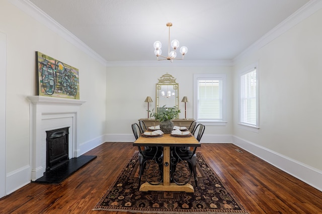 200 E College St, Valdosta, GA 31602 - dining room featuring baseboards, ornamental molding, dark wood-style flooring, and a notable chandelier