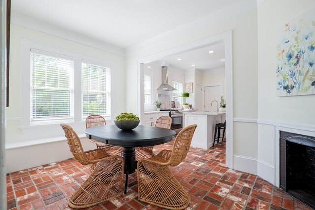 200 E College St, Valdosta, GA 31602 - dining space with crown molding, baseboards, brick floor, and recessed lighting