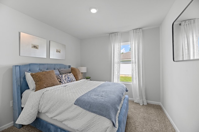 bedroom with carpet and baseboards