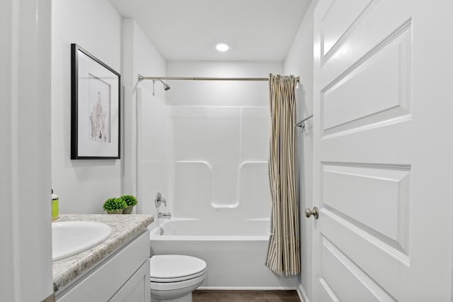 full bathroom with toilet, shower / bathtub combination with curtain, and vanity