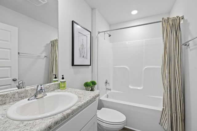 bathroom with toilet, vanity, and shower / bathtub combination with curtain