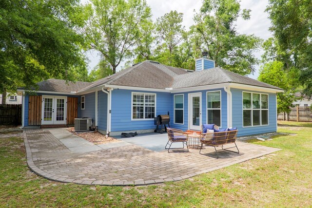 4608 Rustic Ridge Rd, Valdosta, GA 31602 - rear view of house with french doors, central AC unit, a patio, a chimney, and roof with shingles