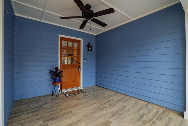 entrance to property with a ceiling fan