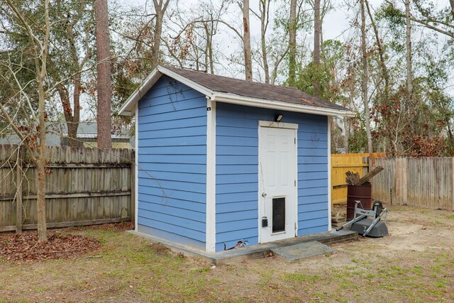 view of shed featuring a fenced backyard