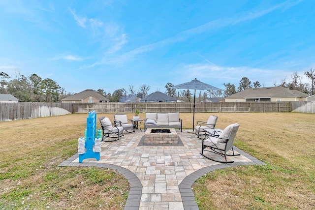 view of patio with a fenced backyard and an outdoor living space with a fire pit