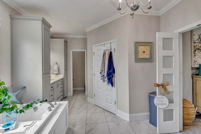 bathroom with a bath, marble finish floor, crown molding, and vanity