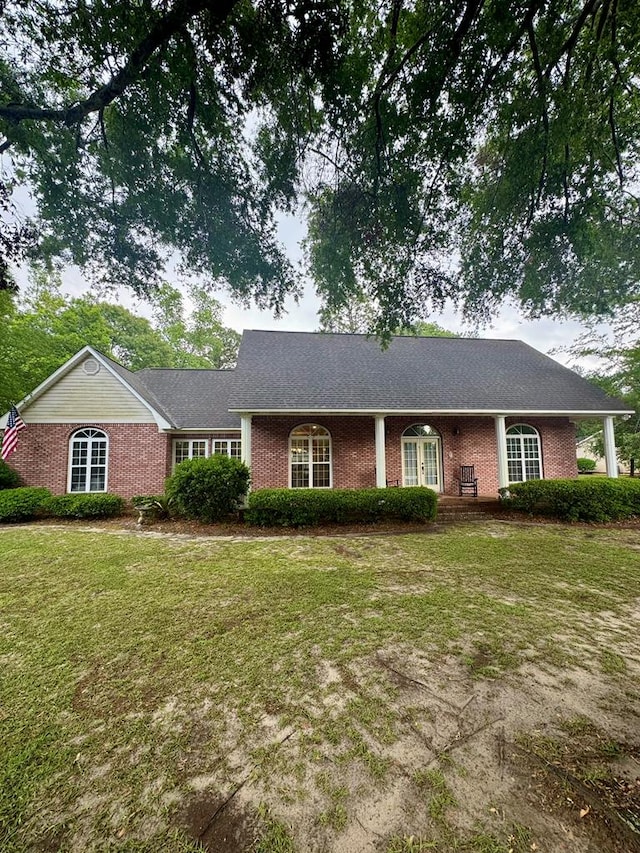 1708 Jimmy St, Adel, GA 31620 - ranch-style house with brick siding and a front lawn