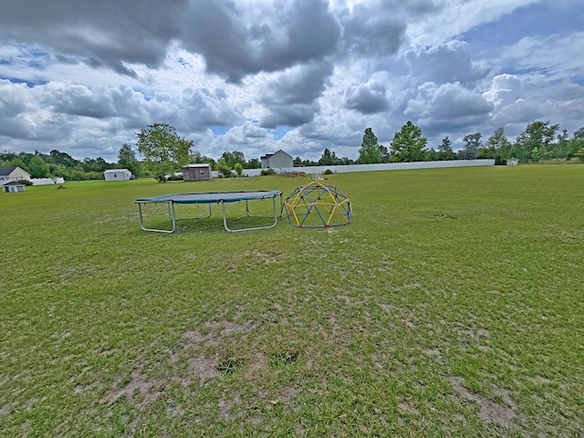3265 Summer Meadows Rd, Valdosta, GA 31601 - view of property's community with a trampoline and a lawn