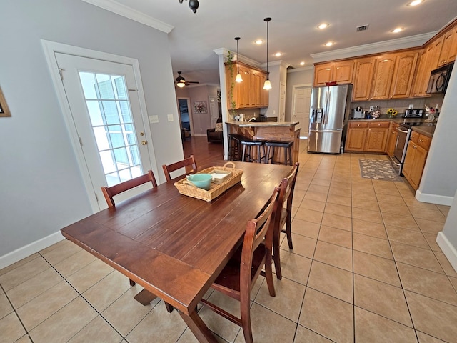 3265 Summer Meadows Rd, Valdosta, GA 31601 - dining space featuring ornamental molding, light tile patterned floors, ceiling fan, baseboards, and recessed lighting
