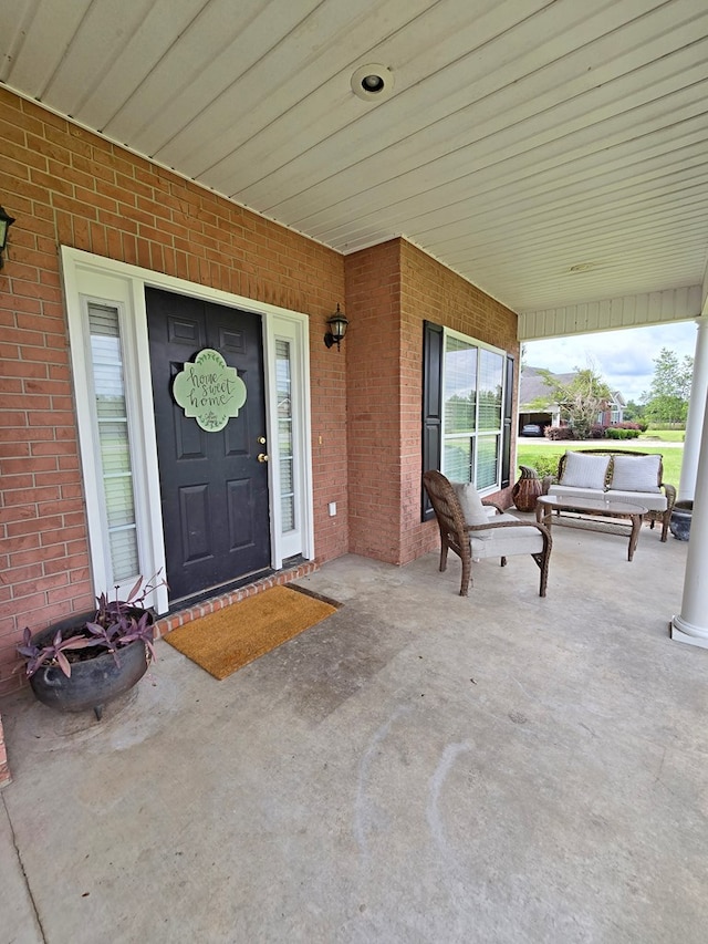 3265 Summer Meadows Rd, Valdosta, GA 31601 - doorway to property featuring covered porch and brick siding