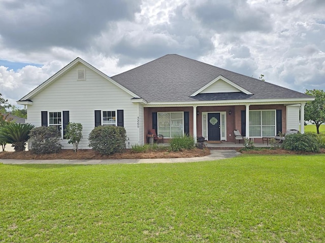 3265 Summer Meadows Rd, Valdosta, GA 31601 - view of front facade with a shingled roof, a front yard, and a porch