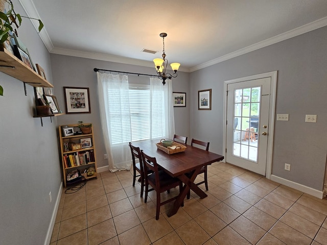 3265 Summer Meadows Rd, Valdosta, GA 31601 - dining area featuring a chandelier, light tile patterned flooring, ornamental molding, and baseboards