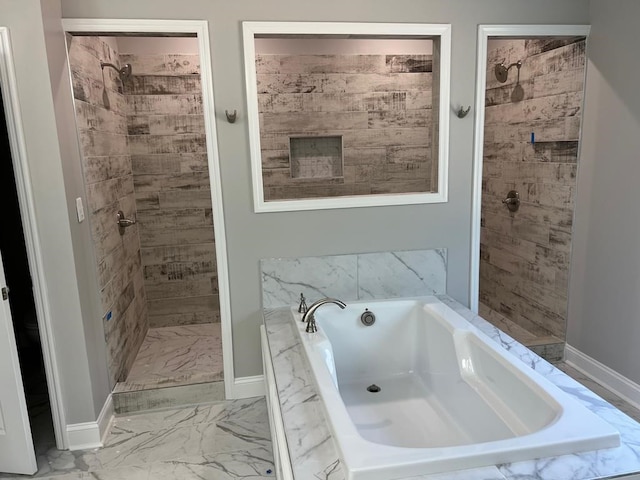 bathroom with shower with separate bathtub