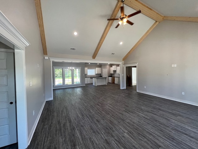 unfurnished living room with ceiling fan with notable chandelier, dark hardwood / wood-style flooring, high vaulted ceiling, and beamed ceiling