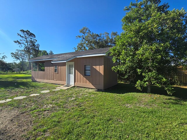 617 Ledgedale Cir, Valdosta, GA 31602 - rear view of house featuring an outbuilding and a lawn