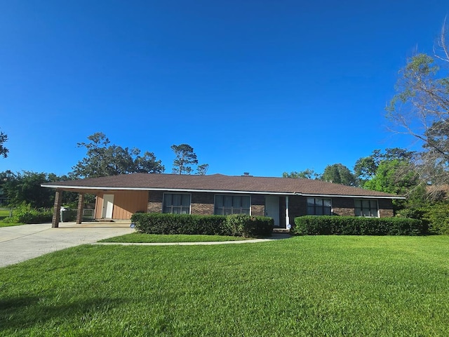 617 Ledgedale Cir, Valdosta, GA 31602 - ranch-style house with a carport, concrete driveway, a front yard, and brick siding
