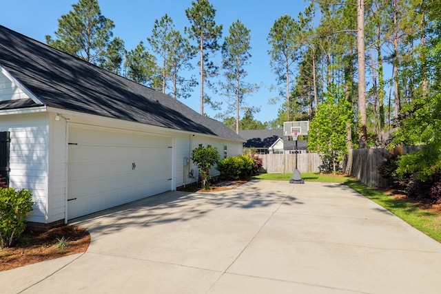 4773 Pawnee Dr, Hahira, GA 31632 - view of home's exterior with fence, a garage, and driveway