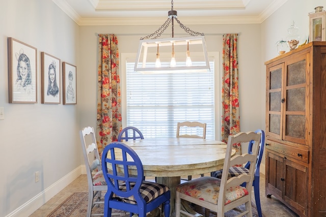 4773 Pawnee Dr, Hahira, GA 31632 - dining area featuring healthy amount of natural light, ornamental molding, a tray ceiling, and baseboards