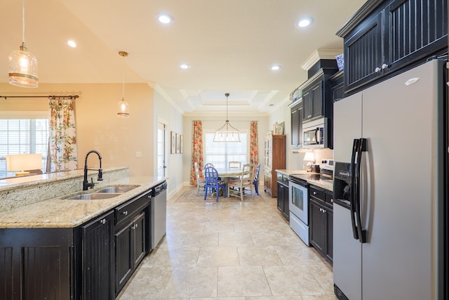 4773 Pawnee Dr, Hahira, GA 31632 - kitchen with stainless steel appliances, a sink, dark cabinets, a raised ceiling, and recessed lighting