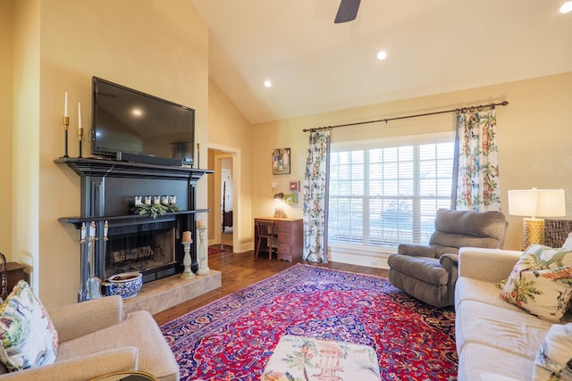 4773 Pawnee Dr, Hahira, GA 31632 - living area featuring lofted ceiling, a fireplace with raised hearth, wood finished floors, ceiling fan, and recessed lighting
