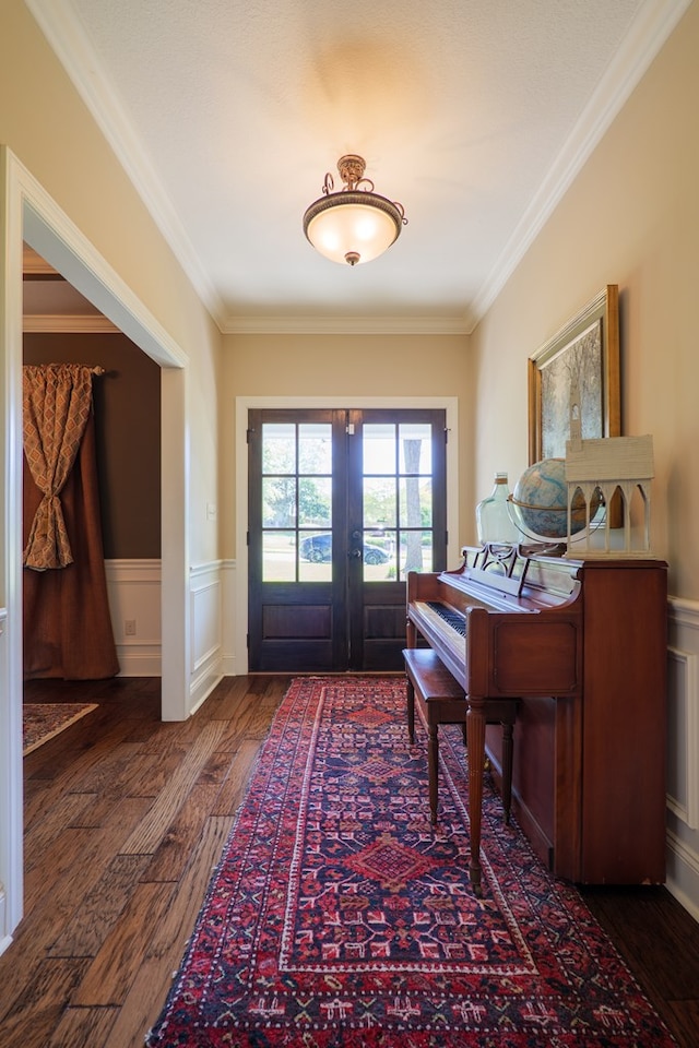 4773 Pawnee Dr, Hahira, GA 31632 - entryway with hardwood / wood-style floors, french doors, crown molding, wainscoting, and a decorative wall
