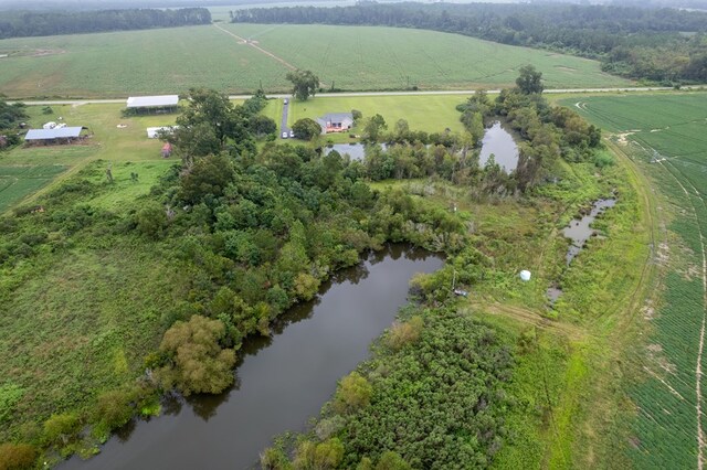 birds eye view of property with a rural view and a water view