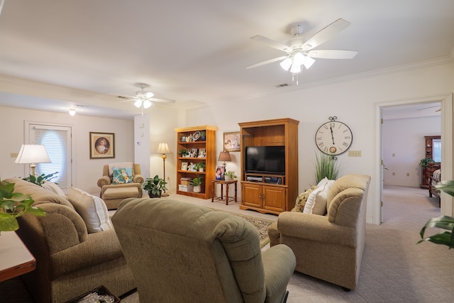 carpeted living room with ornamental molding and ceiling fan